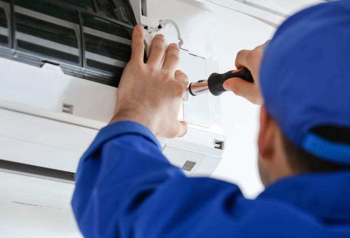 Technician performing aircon installation in Singapore